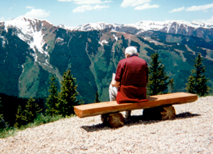 Max Sitting on a Bench with viewing Mountains